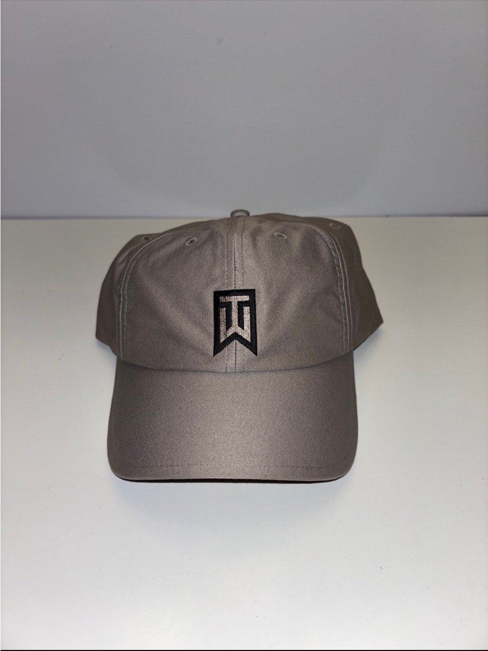 NWT grey Nike Tiger Woods golf hat with a prominent embroidered TW logo